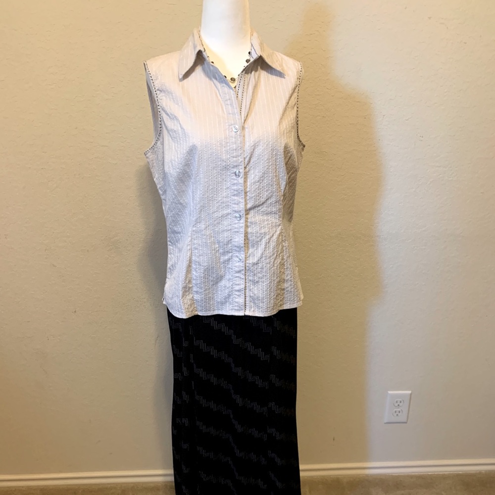 White shirt sleeve with black and white skirt